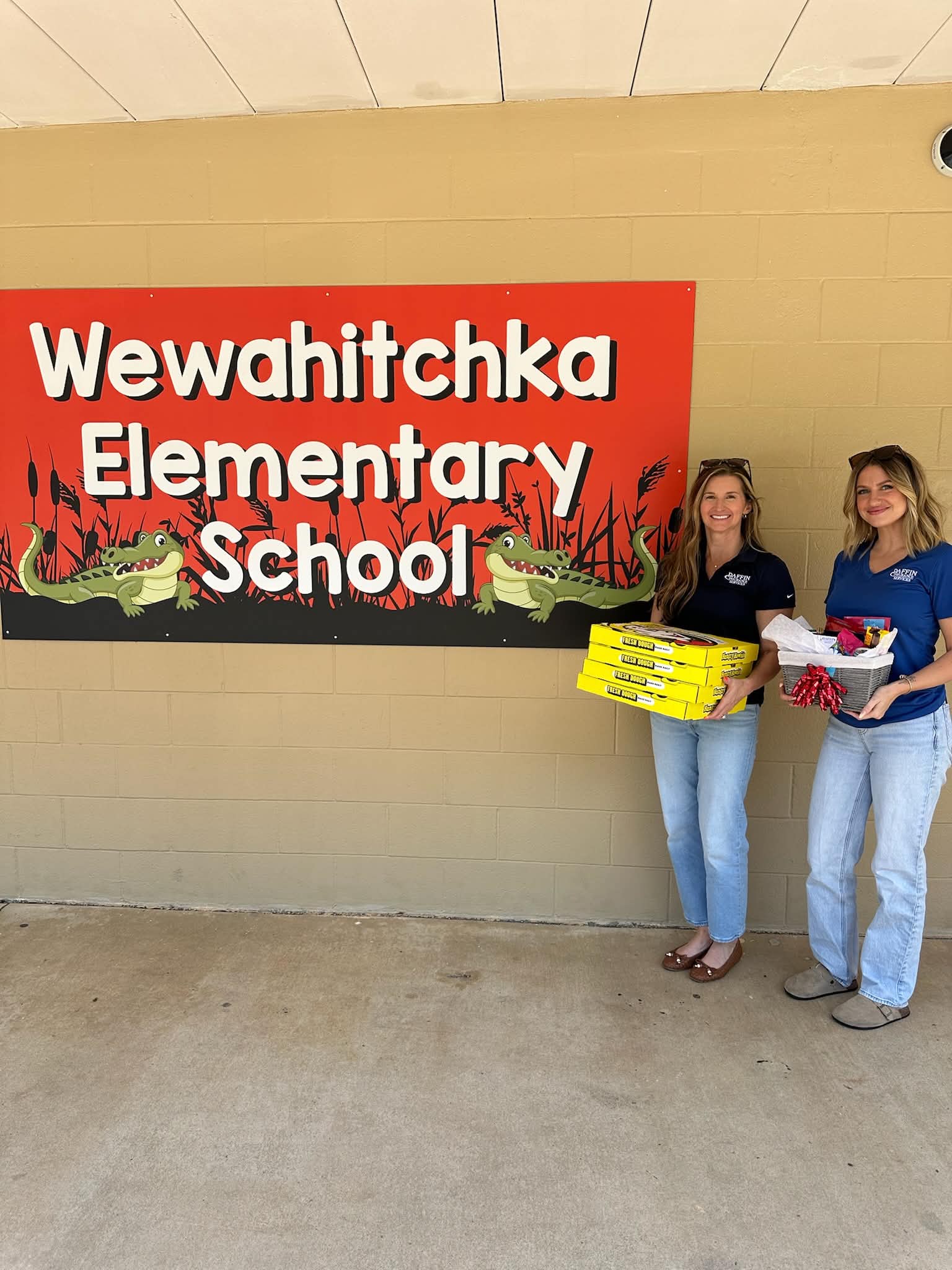 Sheena and Shannon delivering pizza to Wewahitchka Elementary School